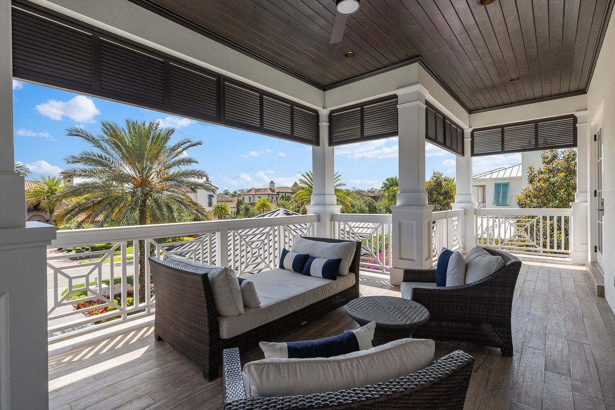 balcony with white railing and patio furniture